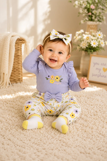 Child smiling in comfortable colorful clothing